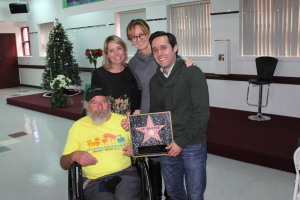 John Peterson being presented with his own star by HPOA staff members Sarah Besley, Kerry Morrison and Joe Mariani.