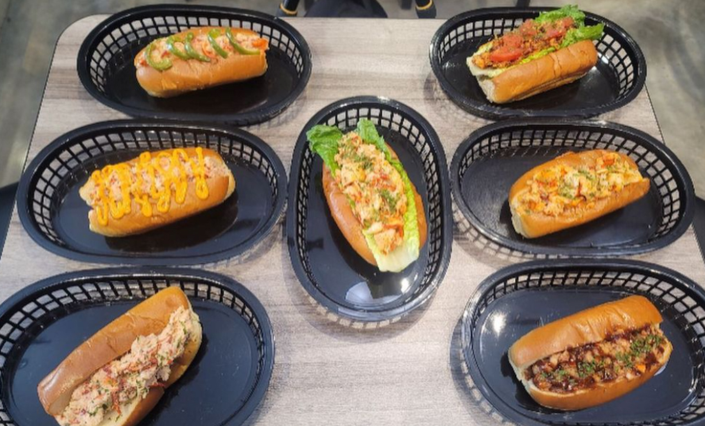 The restaurant offers a variety of lobster rolls named after different neighborhoods tossed in different sauces and dressings. 