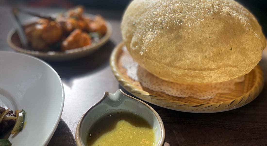 The Scallion Bubble Pancake, a fun shareable dish that comes with curry dipping sauce.
