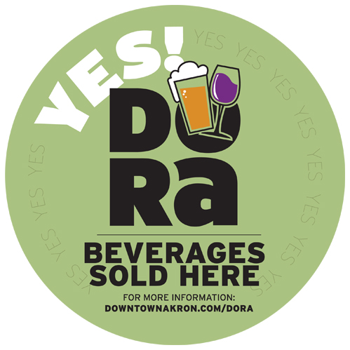 Image of a downtown Akron DORA decal, indicating that DORA Beverages are sold here.